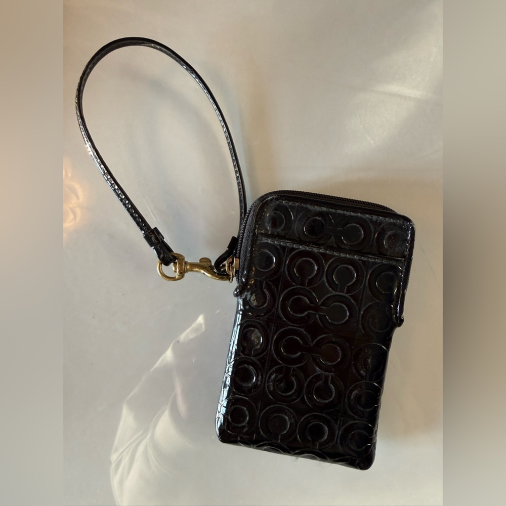 Black Coach Wristlet with Embossed Pattern